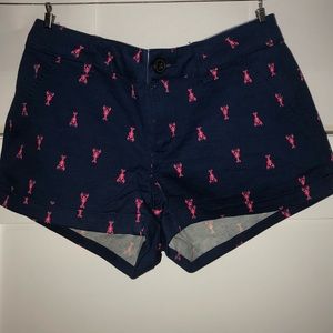 Navy blue shorts with bubblegum pink lobster print